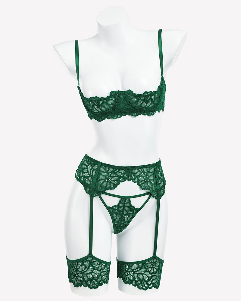 Green lace lingerie set with garter belt and matching briefs, shown on mannequin