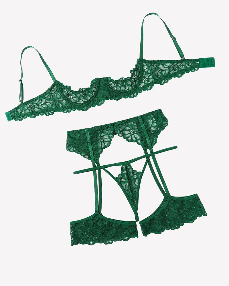 Green lace lingerie set pieces: lace bra, garter belt, suspender briefs and garters