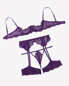 Purple lace lingerie set pieces: lace bra, garter belt, suspender briefs and garters