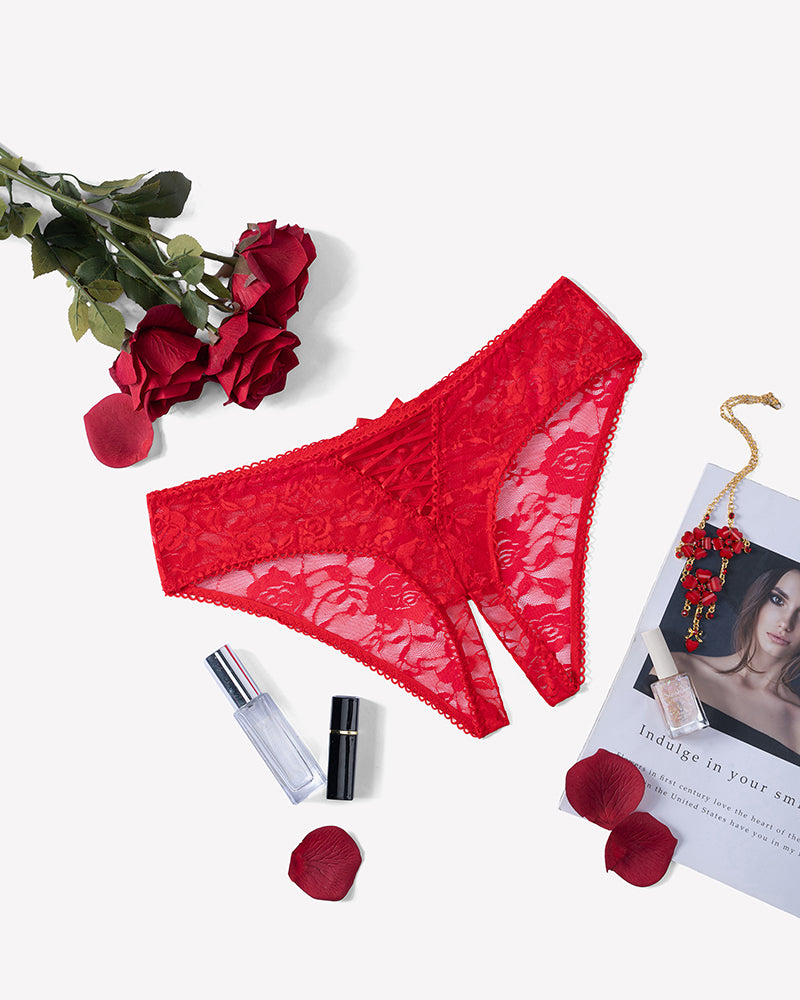 Floral lace boyshort panties with hollow-out style in red, flat lay view.