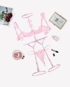 Pink lace garter lingerie set with bra, choker, and thong-style bottoms