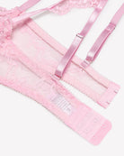 Pink lace bra and garter straps with hook-and-eye band