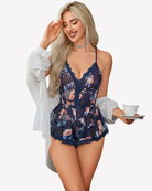 Navy floral cami romper with lace V-neck and sheer bodice