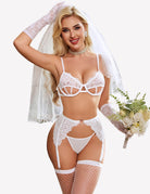 White lace cut-out bra and panty set with garters, fishnet stockings
