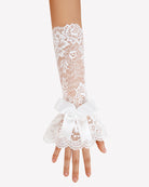 White lace fingerless gloves with satin bow and scalloped ruffle cuff