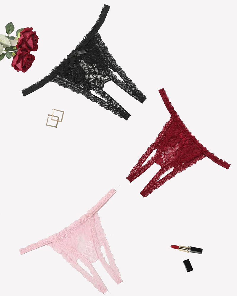 Set of lace thong panties in black, red, and pink with floral pattern, low-rise cut.