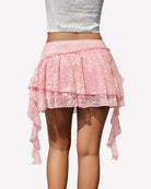 Soft pink lace pleated mini skort with stacked ruffles and dangling side ties