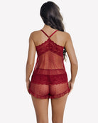 Back view of red polka-dot mesh lace cami and shorts pajama set with crisscross straps