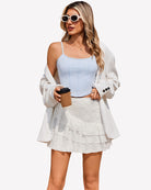 White lace mini skirt with tiered ruffle hem, high waist A-line