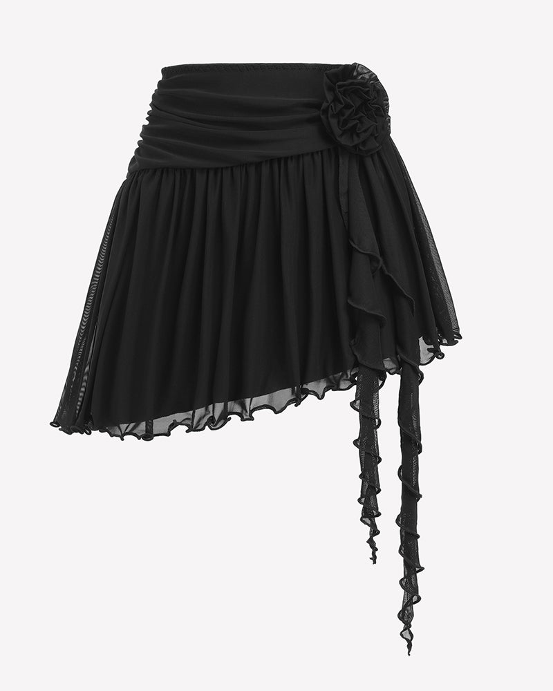 Black tulle mini skirt with rosette waist detail, asymmetric layers, and long ties