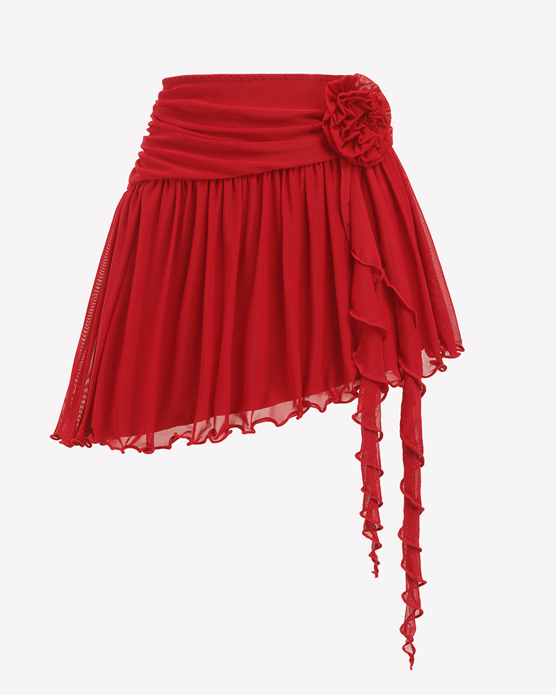Red mesh mini skirt with rosette flower at waistband and layered asym hem with long dangling ties.