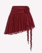Wine red mesh mini skirt with ruched waist, layered ruffles and dangling asymmetric ties