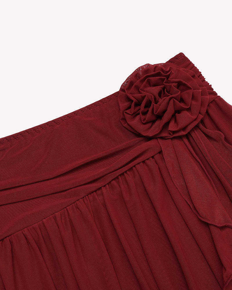 Wine red mesh mini skirt close-up with gathered tiers and rosette flower detail