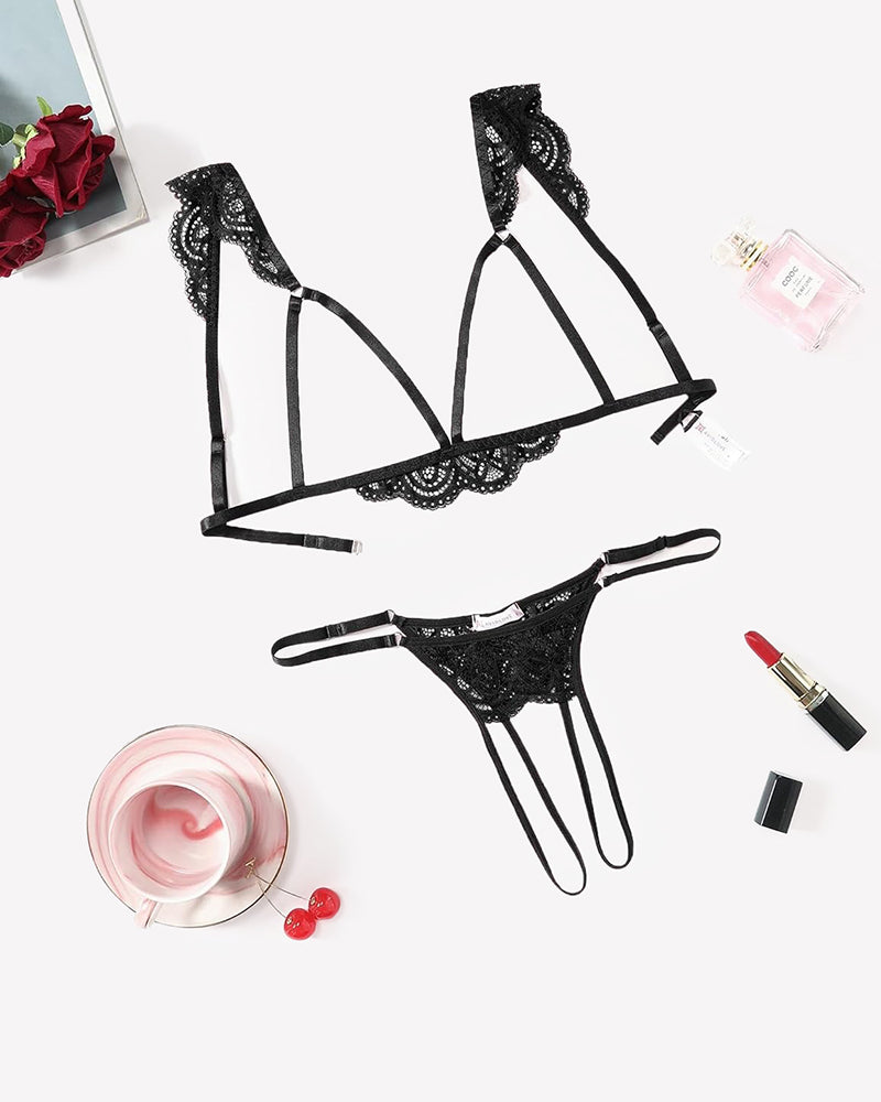 Black lace cutout bra and thong set with scalloped trim and adjustable straps.
