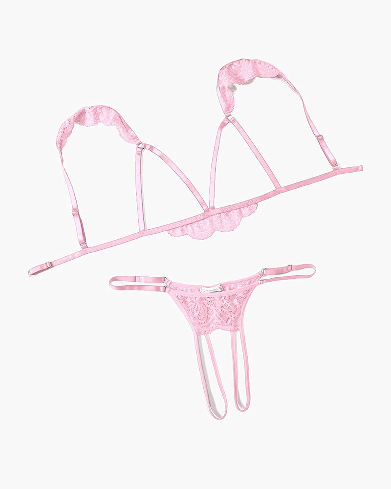 Pink lace cutout bra and thong set with scalloped trim and adjustable garter straps.