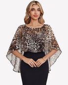 Leopard chiffon cape shawl with loose flutter sleeves over a black fitted dress