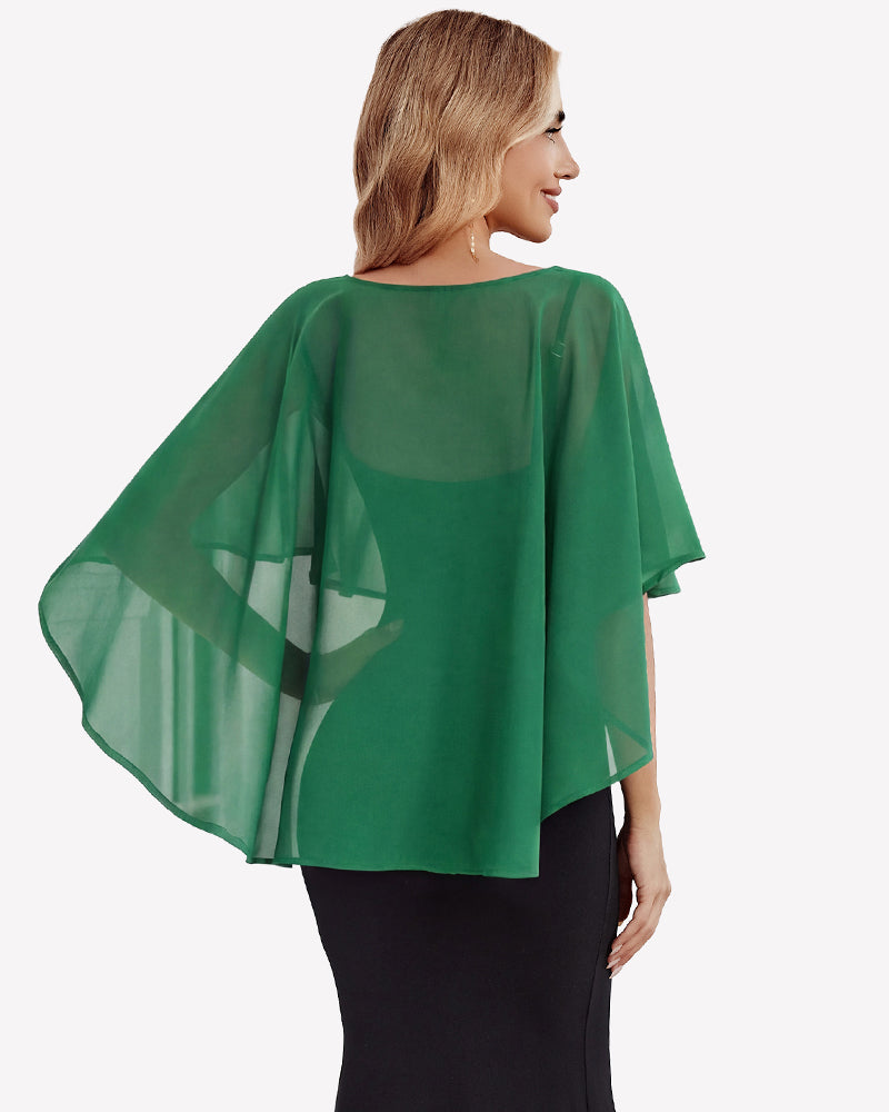 Green chiffon cape shawl with flowing cape back over a black dress