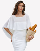 White chiffon cape shawl with loose layered sleeves over white evening dress