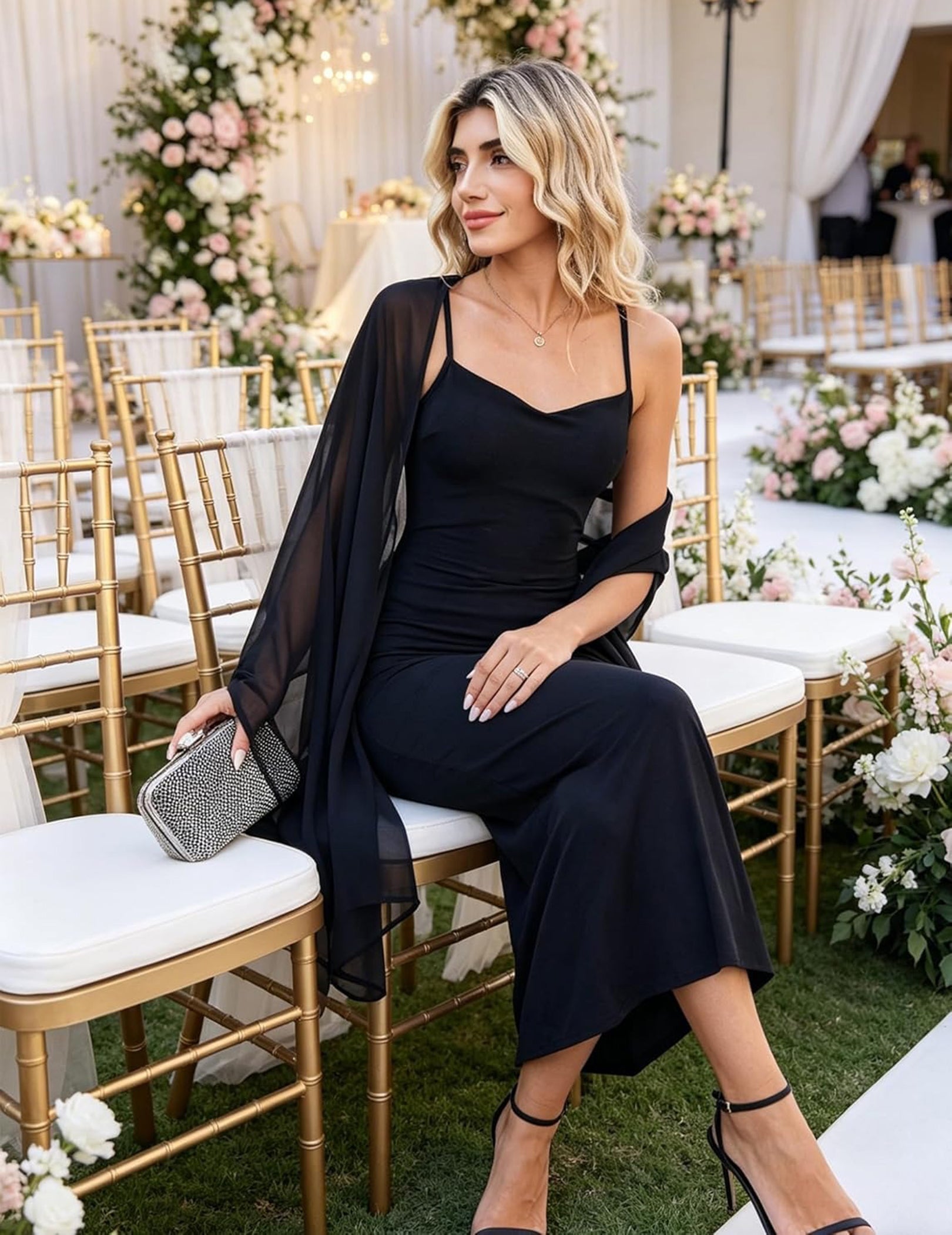 Black chiffon shawl wrap, sheer fabric draped over shoulder and arm