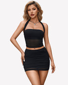Two-piece skirt set with black halter crop top and bodycon mini skirt