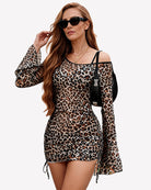 Leopard print bodycon mini dress with off-shoulder straps, sheer long sleeves, ruched front