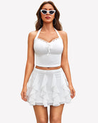 White layered ruffle mini skirt with tiered, scalloped ruffle layers