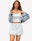 White layered ruffle mini skirt with layered ruffles and flared hem