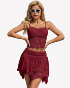 Burgundy lace crop top and mini skirt set with spaghetti straps and asymmetrical hem