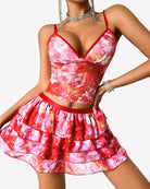 Pink tie-dye two-piece lounge set with V-neck cami top and tiered mini skirt