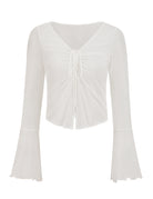 White sheer mesh crop top with a tie front, V-neck, and long bell sleeves