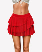 Red layered ruffle mini skirt with tiered flounce design and soft mesh overlay