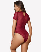 Wine red mock neck sheer mesh bodysuit with rhinestone dot accents, short sleeves, open back