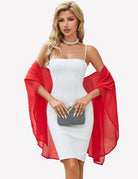 Sheer chiffon shawl wrap in red, draped over shoulders with wide cape-like sleeves