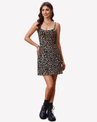 Leopard print spaghetti strap mini dress with fitted waist and flared skirt