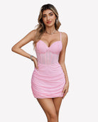 Pink corset mini dress with sweetheart neckline, thin straps, and ruched bodycon fit