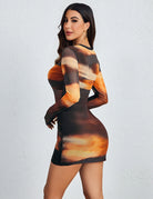 Sunset-style print mesh long-sleeve mini dress with mock neck, ruched bodycon fit