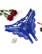 Royal blue lace thong panties with rhinestone side straps, shown at an angle