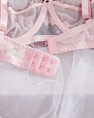 Lilac-pink embroidered thong panty with adjustable straps and bow detail