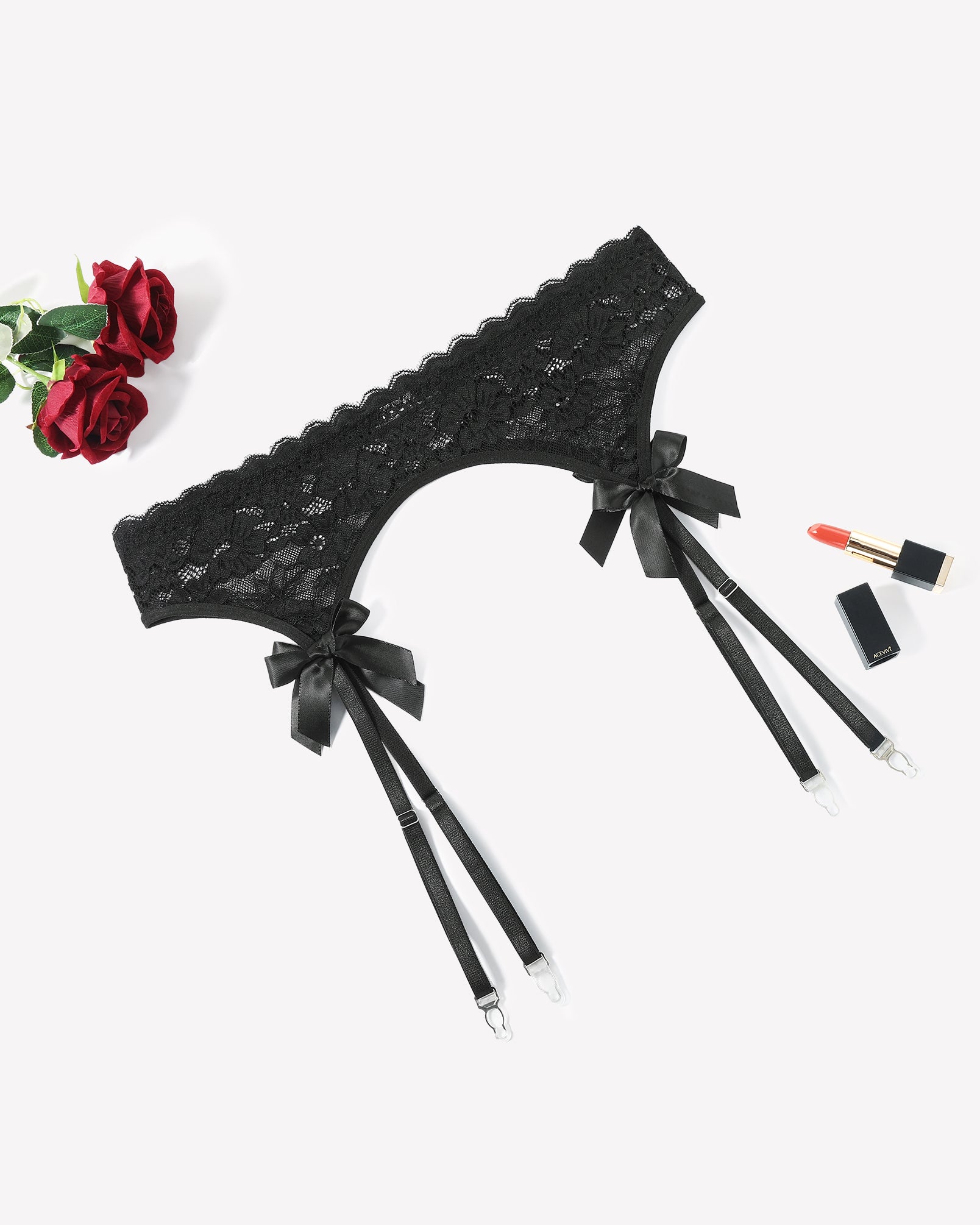 Black lace garter belt with 4 suspender straps and bow accents