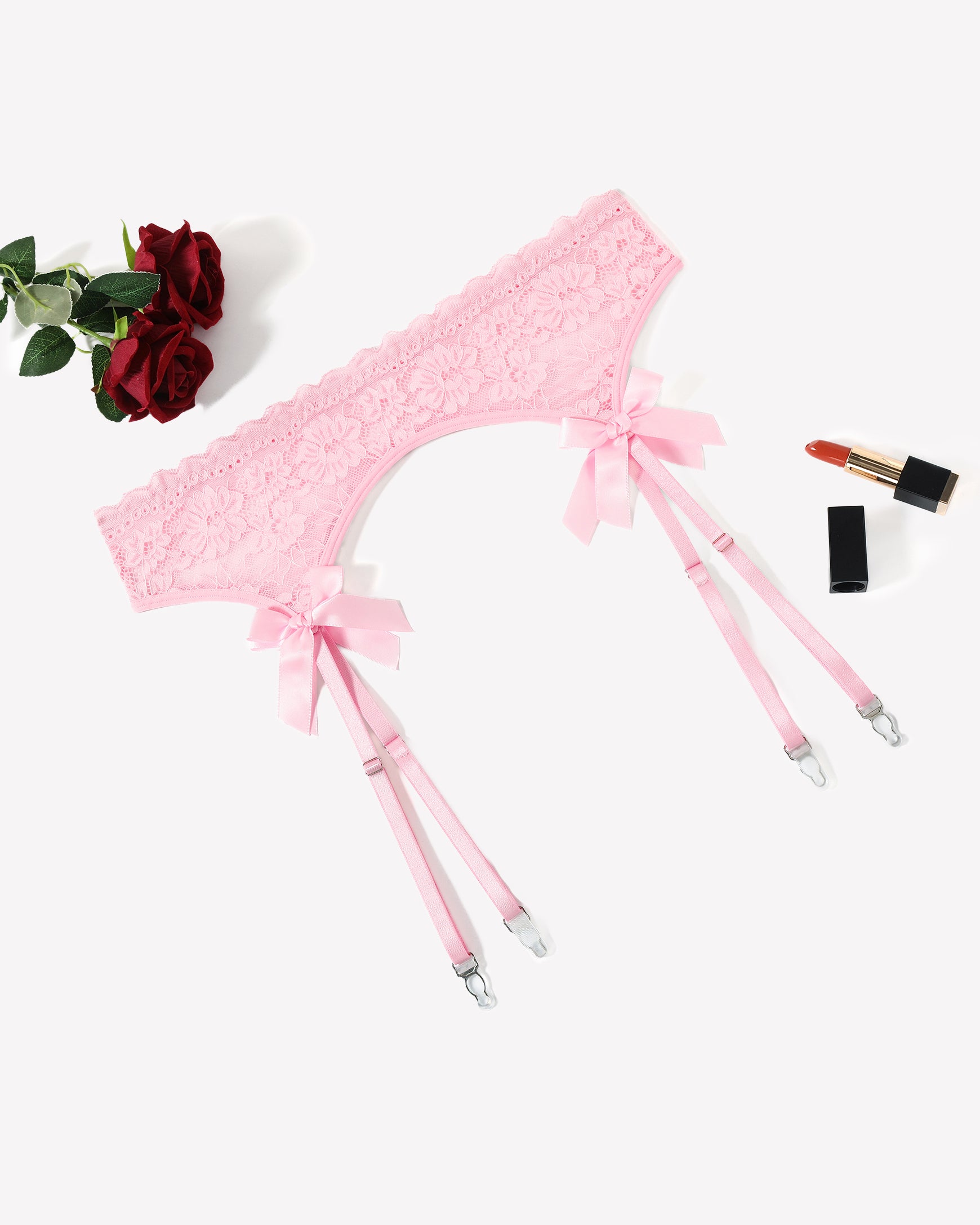 Pink lace garter belt with 4 suspender straps and ribbon bow accents