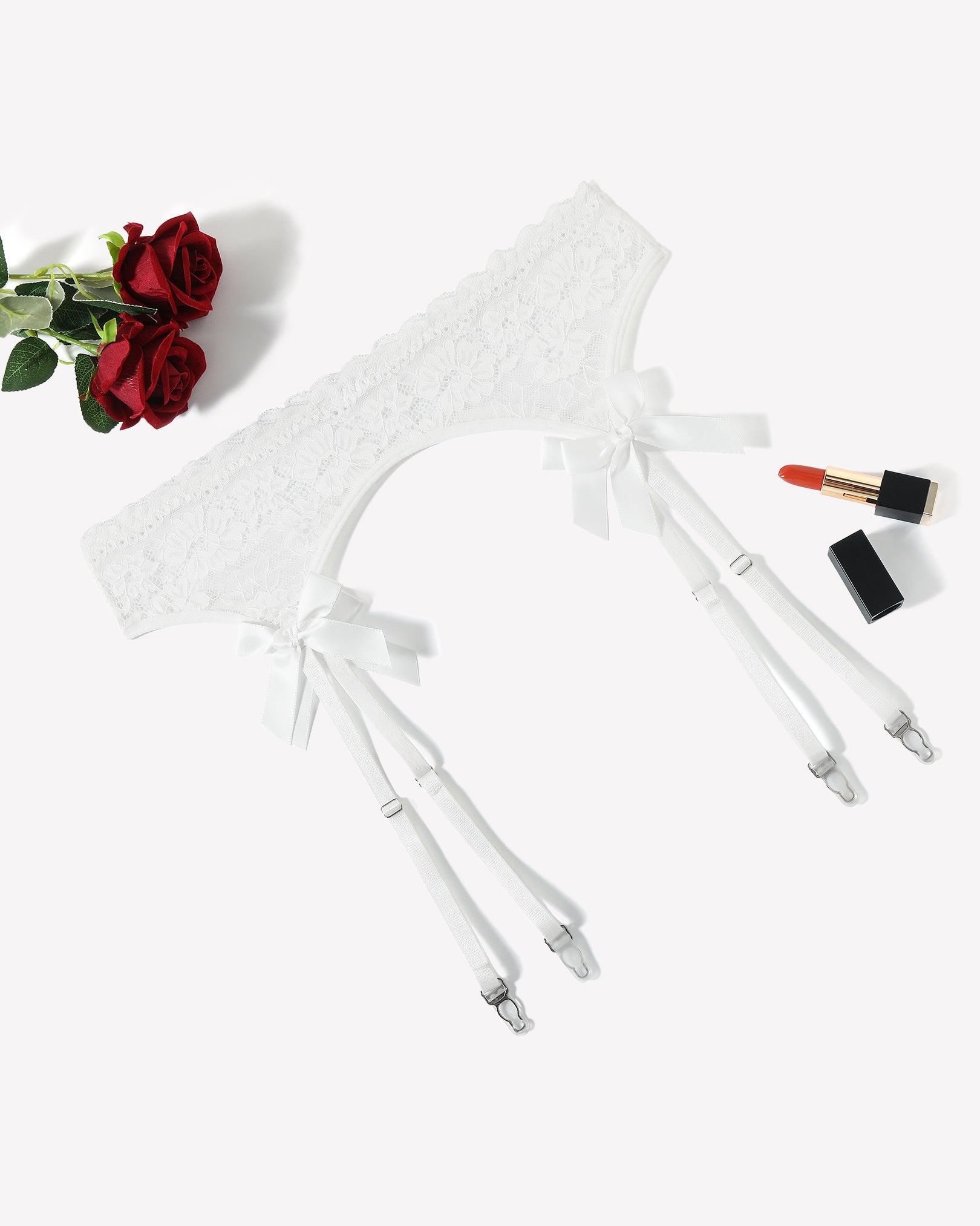 White lace garter belt with four adjustable suspender straps and bow ties