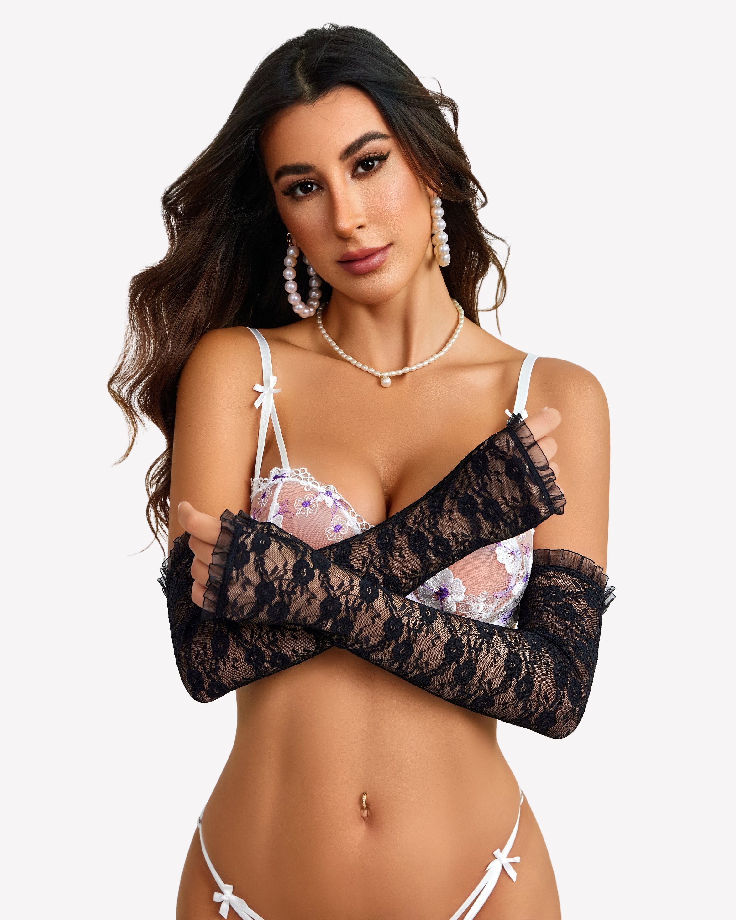 Long black lace fingerless gloves with frilled cuffs on model, sheer forearm coverage