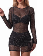 Black sheer mesh mini dress with long sleeves and star-speckled galaxy print