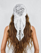 White lace head veil with floral embroidery, long drape, and scalloped edging at ends.