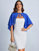 Royal blue chiffon capelet shawl with tiered ruffle layers over a white fitted dress