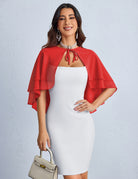 Red chiffon capelet shawl with tiered ruffle layers over a white fitted dress