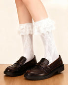 White lace anklet socks with ruffle cuff, sheer knit texture up the leg