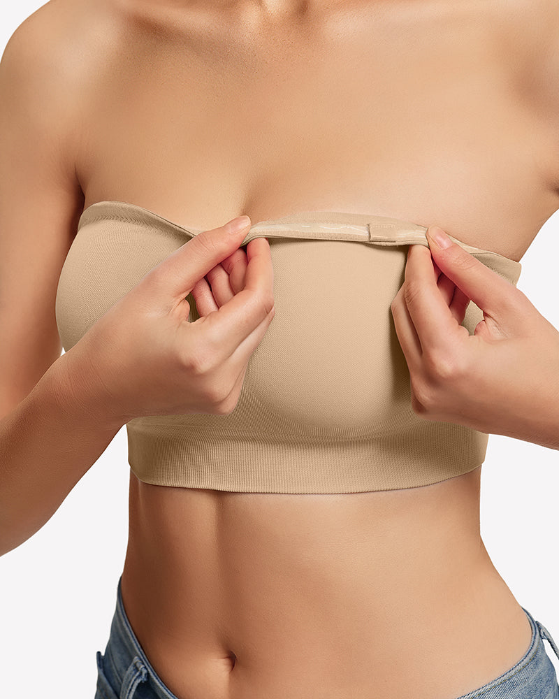 Nude strapless bandeau bra close-up with non-slip grip and edge binding.