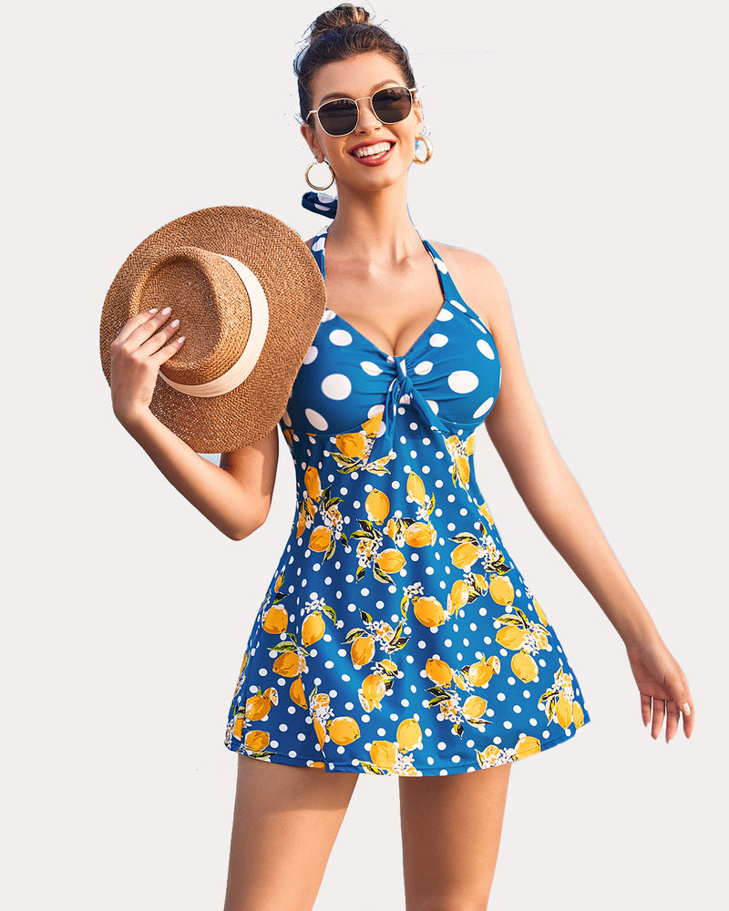 Halter tankini swimsuit in blue with yellow citrus floral print and bow-front detail