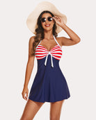 Navy halter tankini swimsuit with red and white striped cups and tie bow